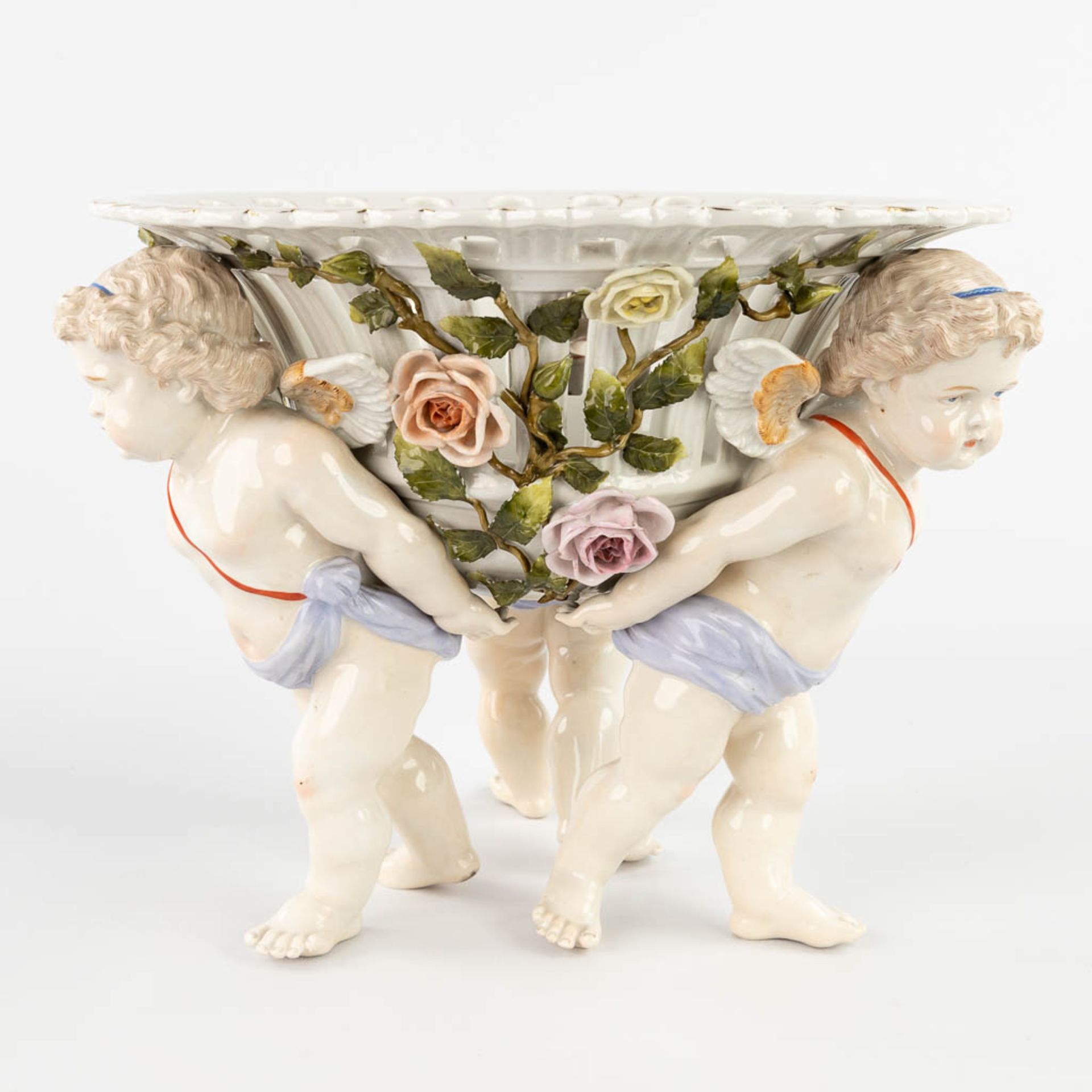 Sitzendorf is a porcelain table centrepiece in the shape of a basket held by putti. 19th C. (H:25 x