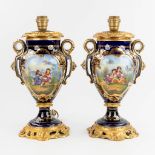 A pair of table lamps with hand-painted decor, porcelain, 20th C. (L:17 x W:24 x H:43 cm)