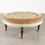 A nice poof, upholstered with fabric. 20th C. (H:38 x D:88 cm)