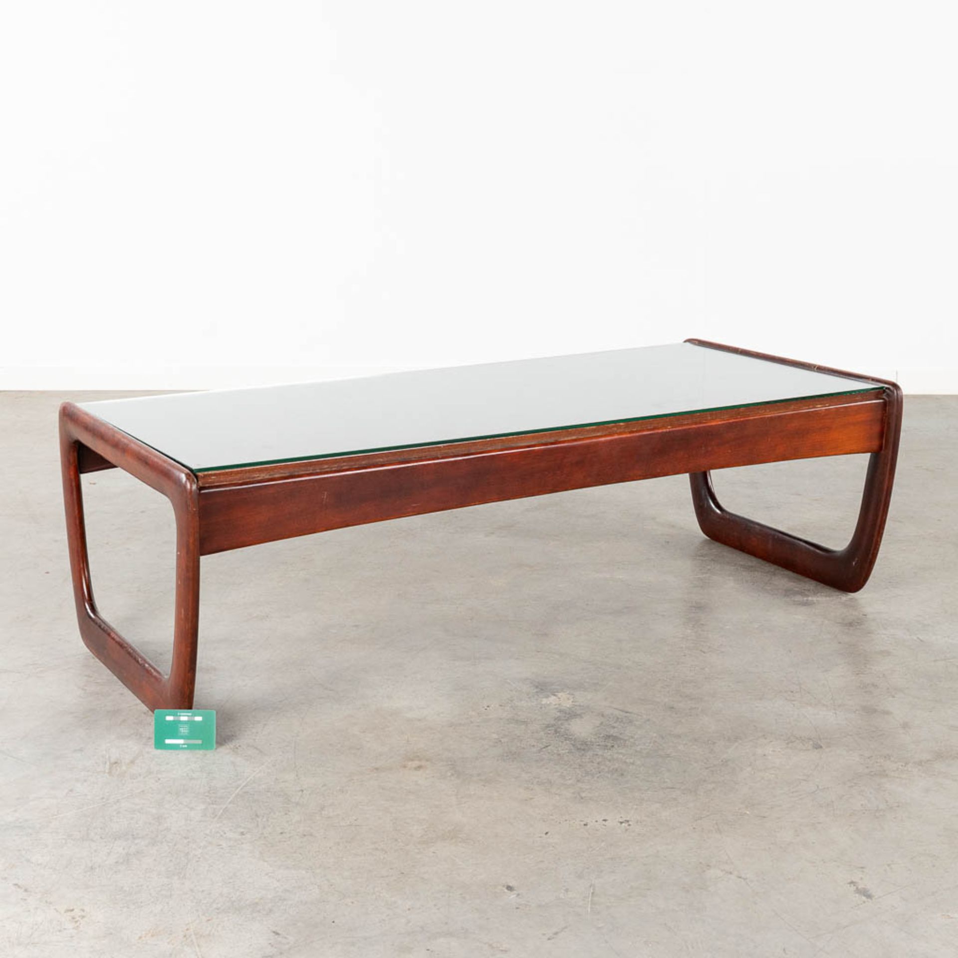 A mid-century coffee table with a glass top, probably teak. (L:30 x W:130 x H:40 cm) - Image 2 of 12