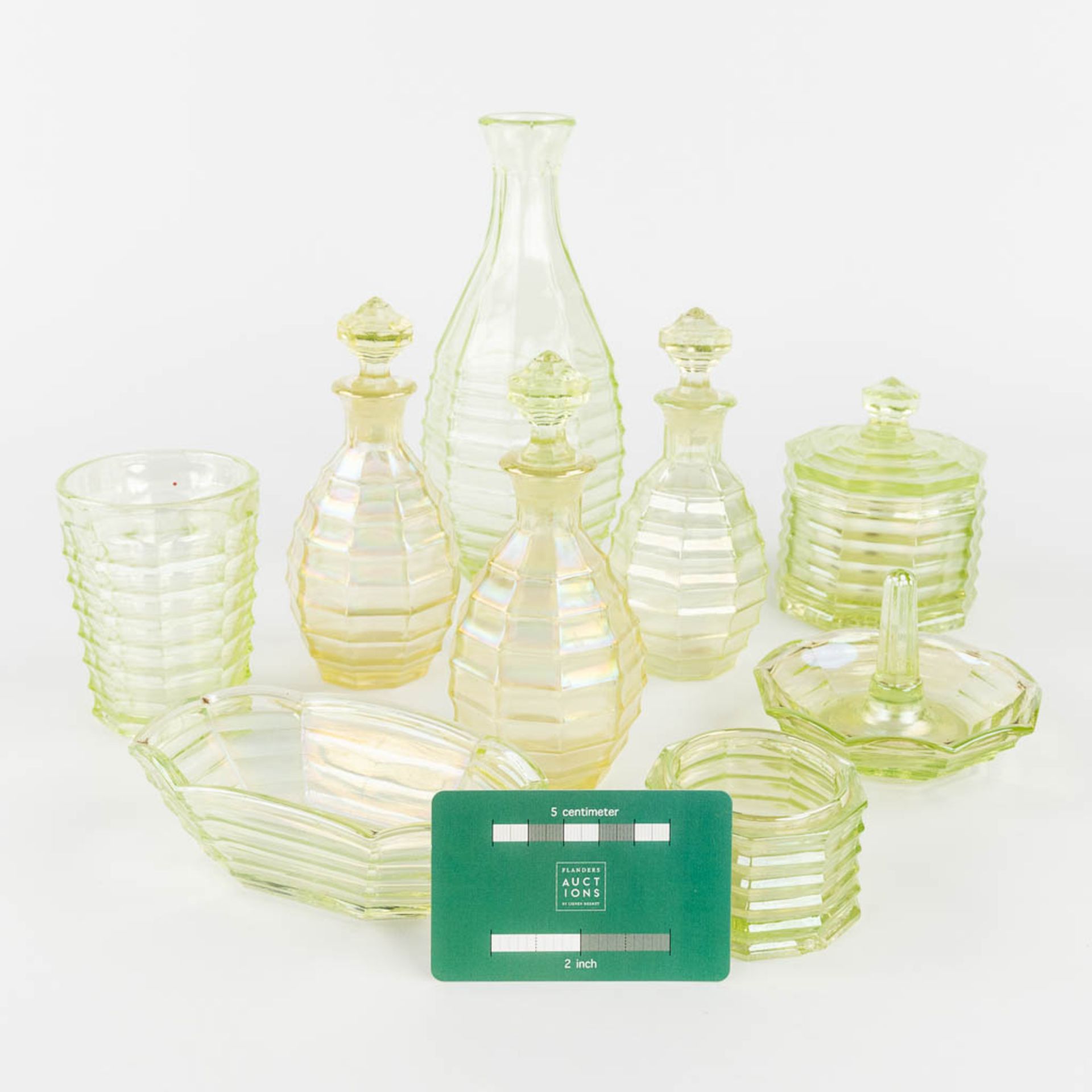 A 9-piece perfume set, made of Uranium glass. (H:21 x D:9 cm) - Image 2 of 15