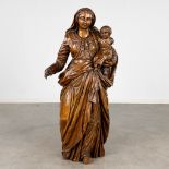 An antique wood sculptured statue of Madonna with a Child. 17th/18th C. (L:27 x W:44 x H:99 cm)
