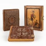Three decorative photo books, leahter and marquetry covers. (D:8 x W:26 x H:32 cm)