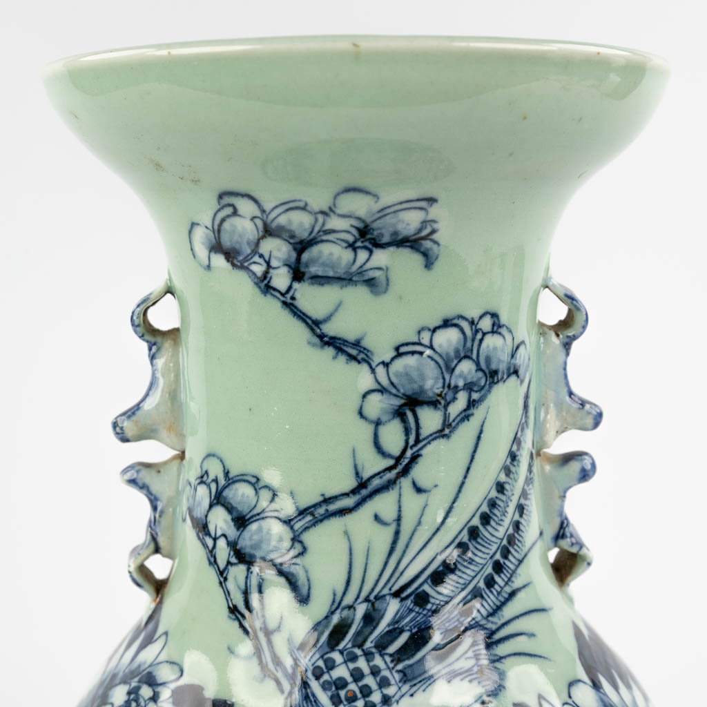 A Chinese celadon vase with blue-white decor of flora. 19th/20th C (H:42 x D:19 cm) - Image 9 of 12