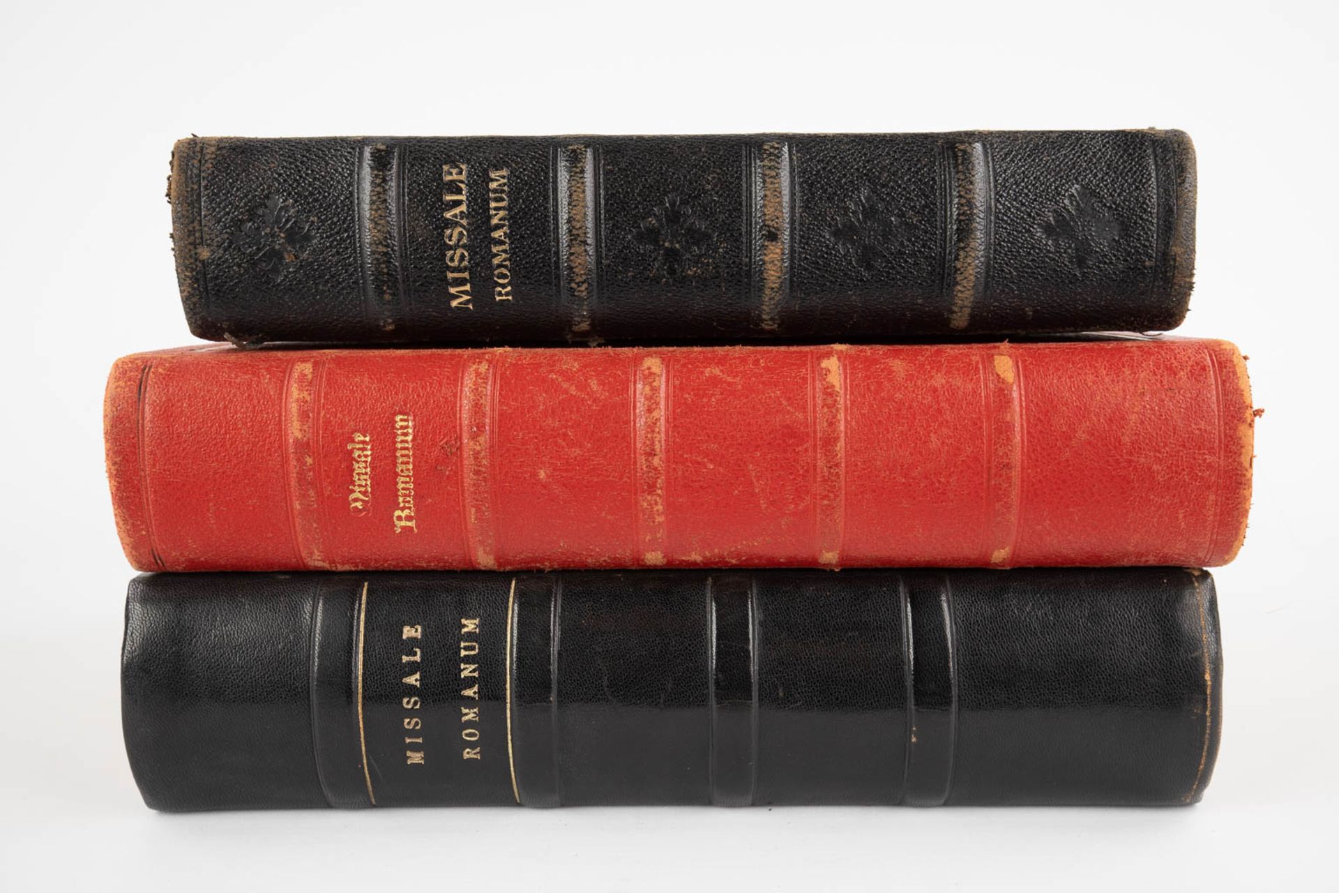 Three Missale Romanum books, 20th C. (D:6 x W:24 x H:32 cm)