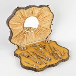 An antique manicure set, silver, mounted in a box. Circa 1900. (D:35 x W:46 x H:6 cm)