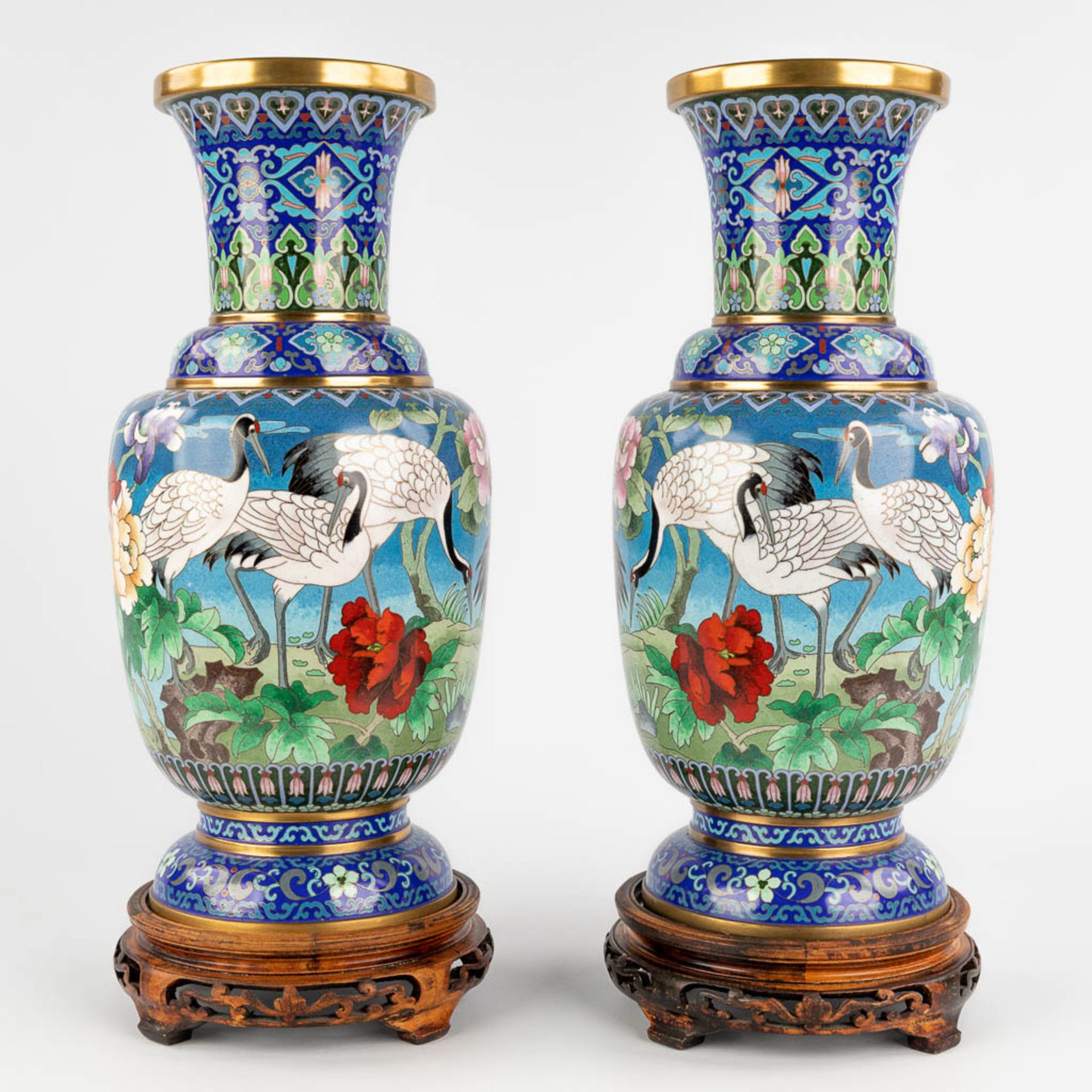 A pair of Chinese bronze cloisonné vases, decorated with cranes and flowers. 20th C. (H:39 x D:18 cm