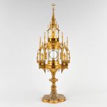 A tower monstrance, gilt brass in a gothic revival style. 19th C. (D:20 x W:25 x H:72 cm)