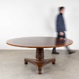 An exceptionally large round table with a marquetry veneer top. (H:77 x D:183 cm)