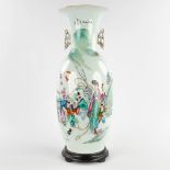 A Chinese vase decorated with a lady and children. 19th/20th C. (H:58 x D:22 cm)