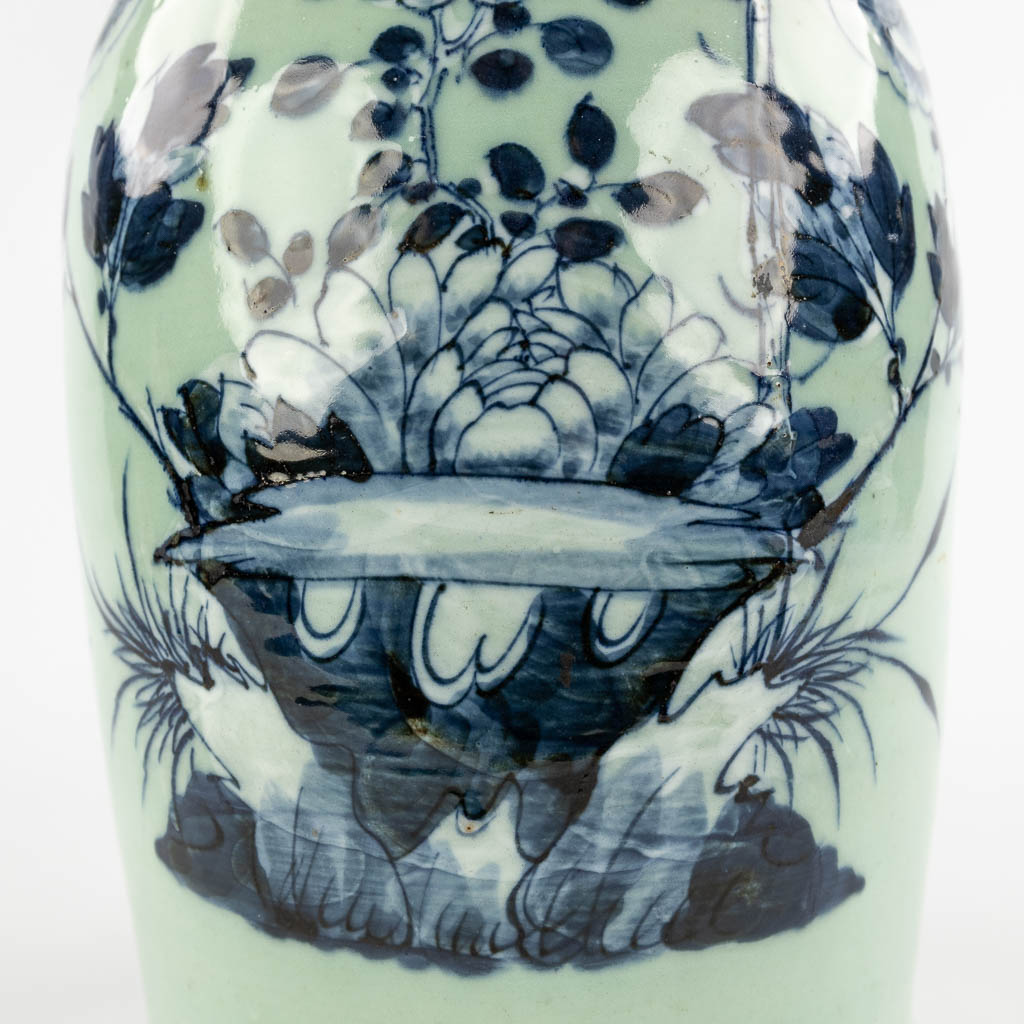 A Chinese celadon vase with blue-white decor of flora. 19th/20th C (H:42 x D:19 cm) - Image 11 of 12