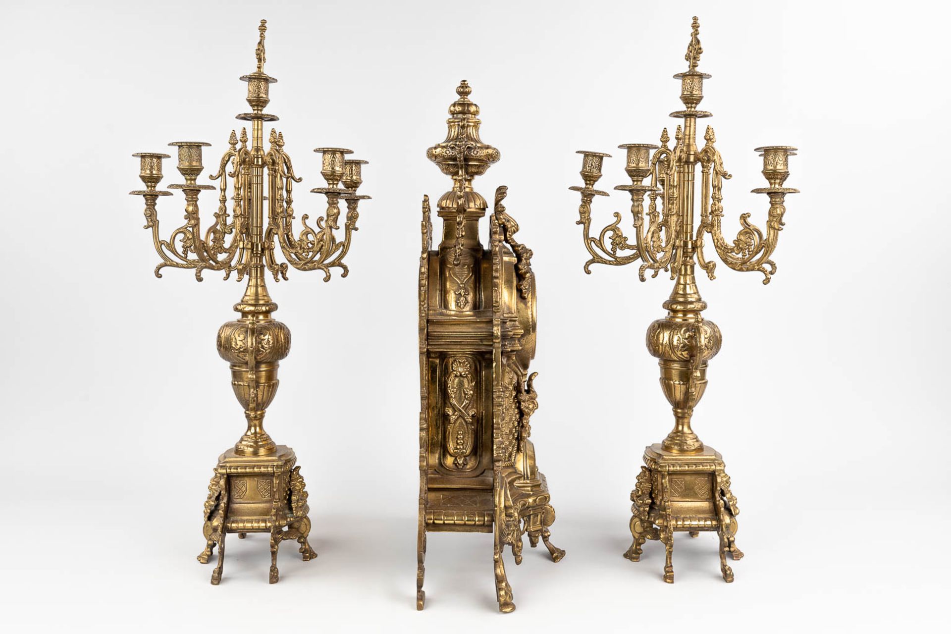 A three-piece mantle garniture consisting of a clock with candelabra, made of bronze. circa 1970. (W - Image 5 of 16