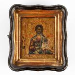 A small Eastern European icon of Jesus Christ, mounted in a gilt frame. 19th C. (W:21,5 x H:25 cm)