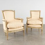 A pair of armchairs, sculptured wood with fabric in Louis XVI style. (D:64 x W:66 x H:92 cm)