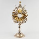 A sunburst monstrance, silver, decorated with angels, wheat and grape vines. Belgium, 19th C. (D:20