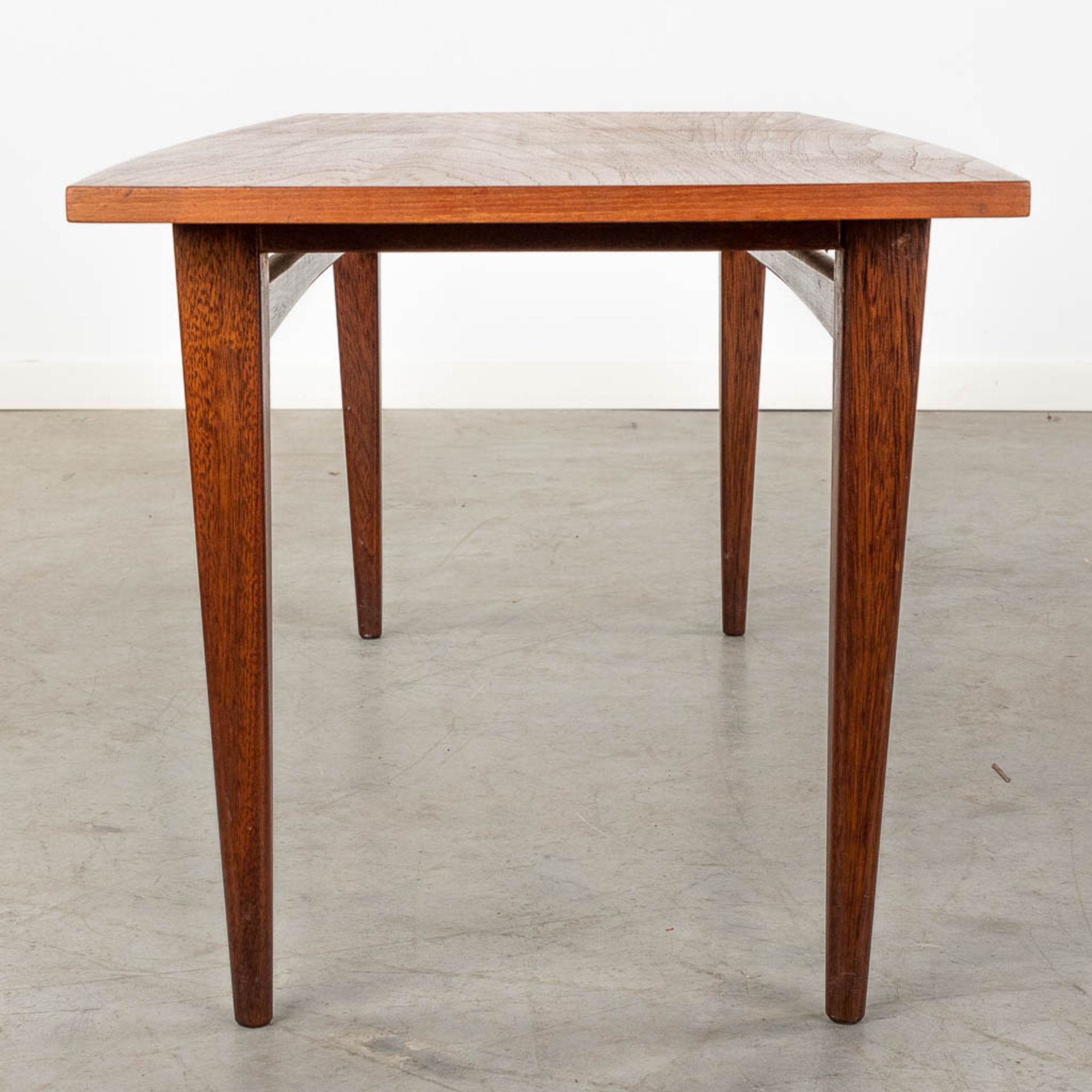 A mid-century Scandinavian coffee table, probably solid teak. (D:50 x W:120 x H:45 cm) - Image 4 of 10