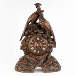 An antique 'Black Forest' mantle clock, decorated with sculptured wood pheasants. Circa 1900. (D:17