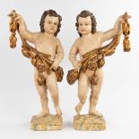 A pair of wood-sculptured angels, polychrome, 18th/19th C. (D:18 x W:34 x H:70 cm)