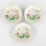 Three Chinese Famille Rose plates, fauna and flora decor, Qianlong mark and period. 18th C. (D:15 cm