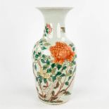 A Chinese vase, decorated with flowers and peonies. 19th/20th C. (H:20 x D:43,5 cm)