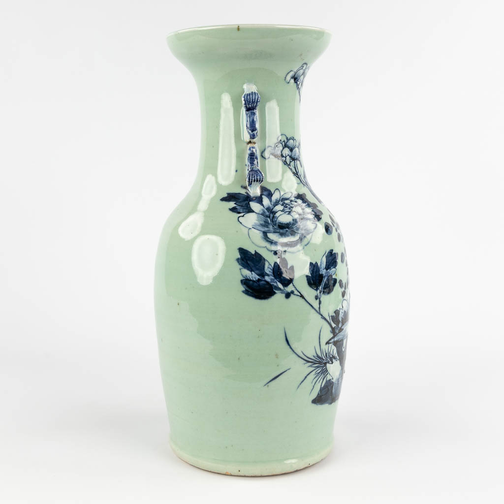 A Chinese celadon vase with blue-white decor of flora. 19th/20th C (H:42 x D:19 cm) - Image 4 of 12