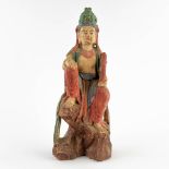 A Chinese sculptured figurine of Guan-Yin, polychrome decor. 19th C. (D:18 x W:21 x H:51 cm)