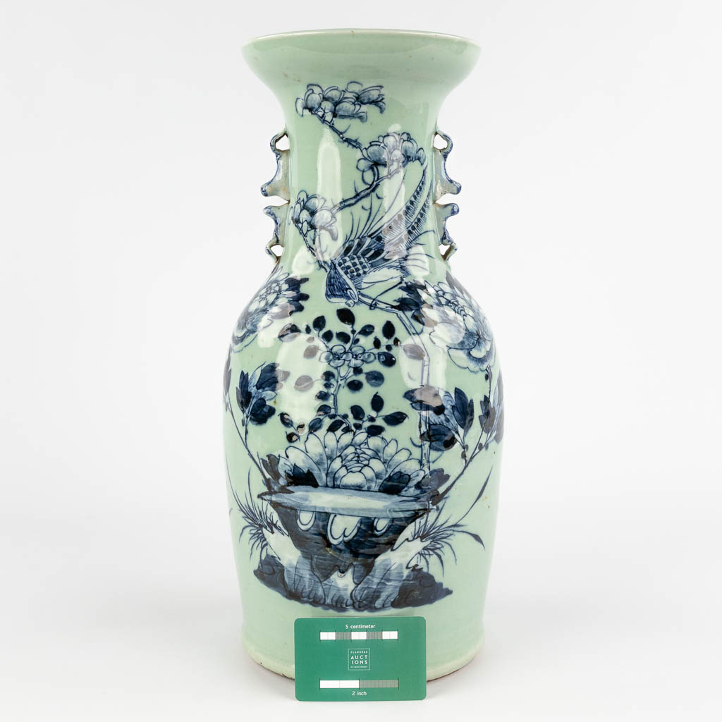 A Chinese celadon vase with blue-white decor of flora. 19th/20th C (H:42 x D:19 cm) - Image 2 of 12