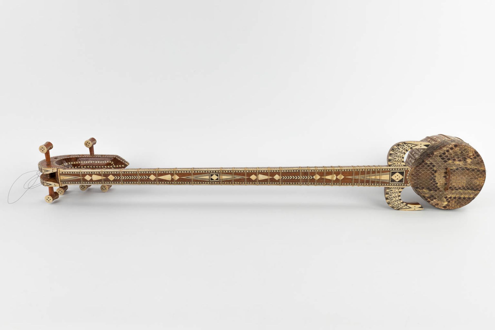 An oriental musical instrument with 6 strings, snake leather and bone inlay. 20th C. (D:13 x W:15 x - Image 3 of 17
