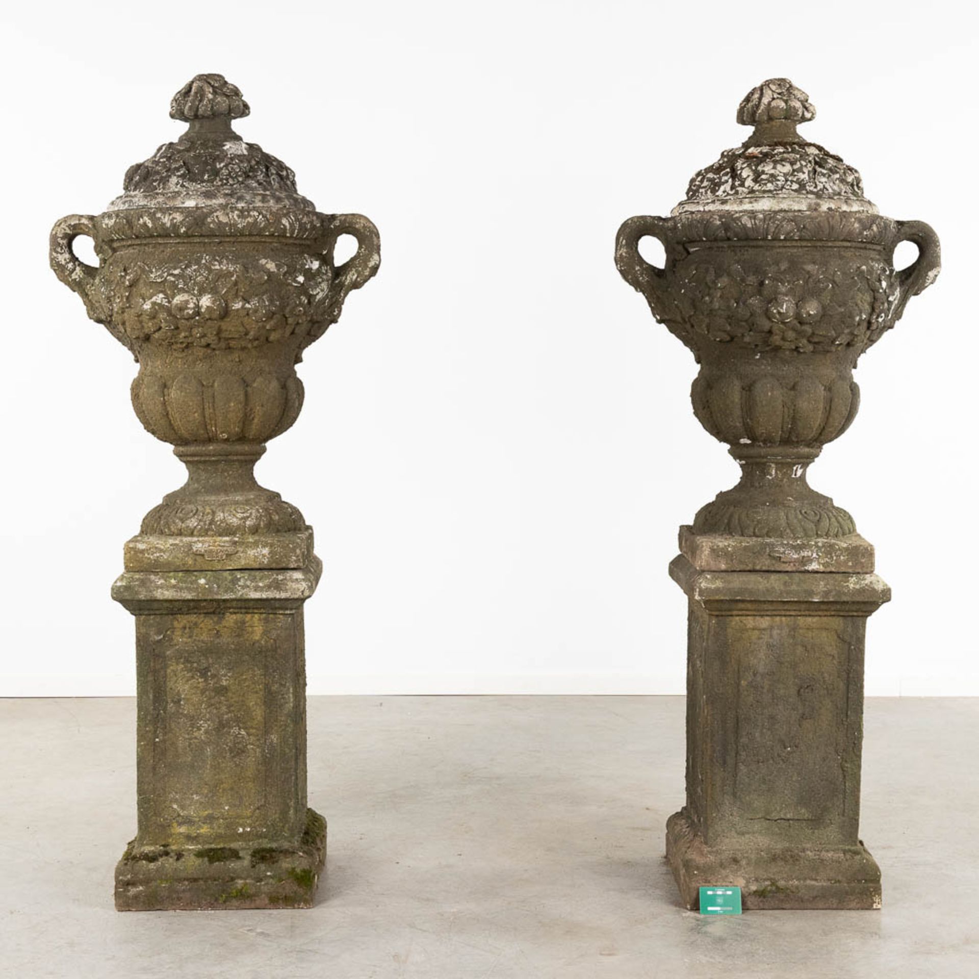 A pair of large urns with a lid, standing on a pedestal, concrete, 20th C. (D:50 x W:67 x H:173 cm) - Image 2 of 8