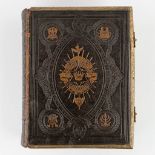 An antique 'Holy Bible' with thick and decorated leather cover. 19th C. (D:9 x W:27 x H:34 cm)