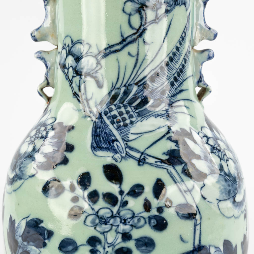 A Chinese celadon vase with blue-white decor of flora. 19th/20th C (H:42 x D:19 cm) - Image 10 of 12