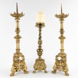 A pair of antique bronze Chruch Candlesticks, and added a candlestick. Circa 1900. (D:18 x W:18 x H: