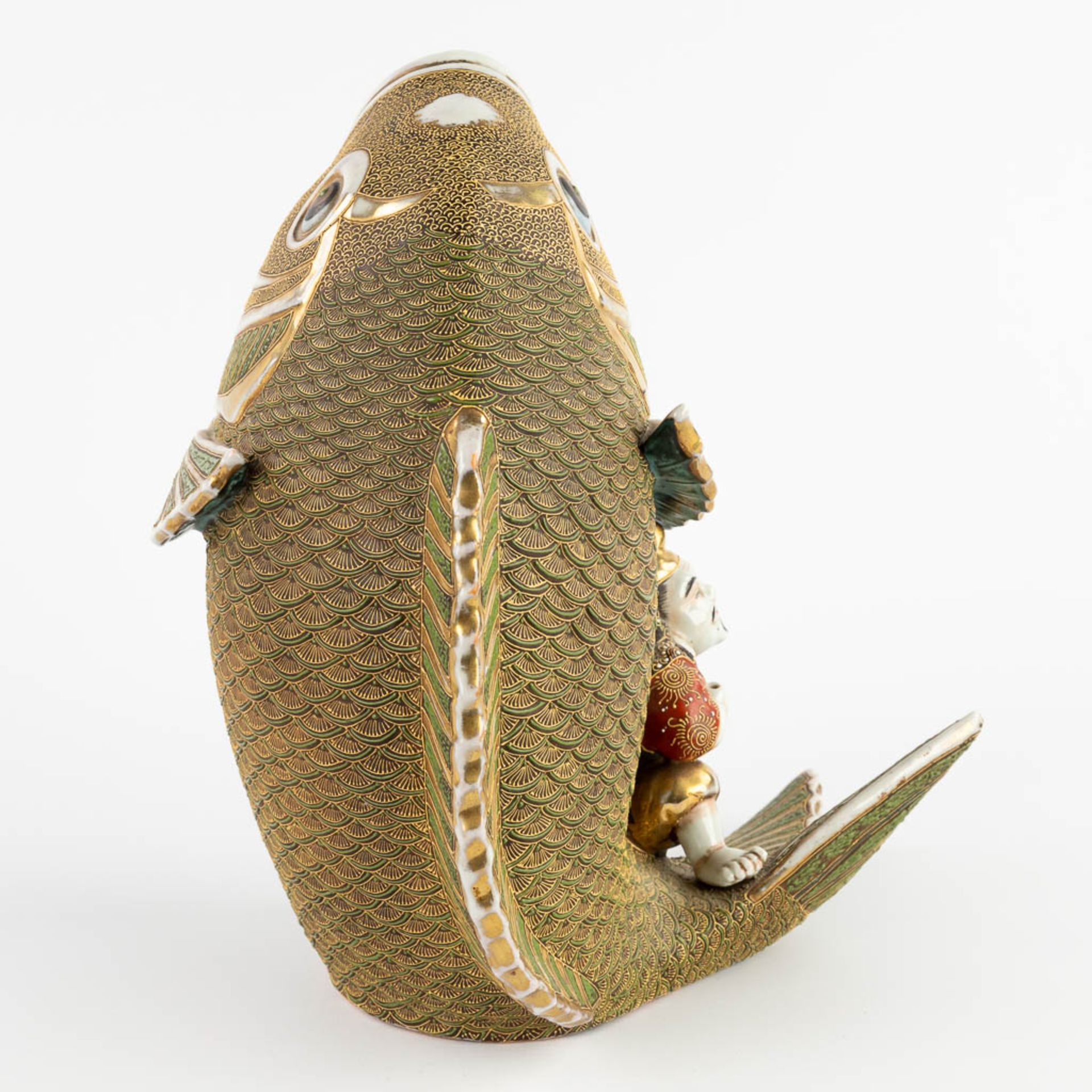 A figurine seaed on a koi, Satsuma stoneware. Meji period. (D:27 x W:26 x H:31 cm) - Image 7 of 11