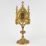 A sealed Theca with a relic: Joannis a Cruce, mounted in a brass monstrance. (D:11,5 x W:13 x H:35 c