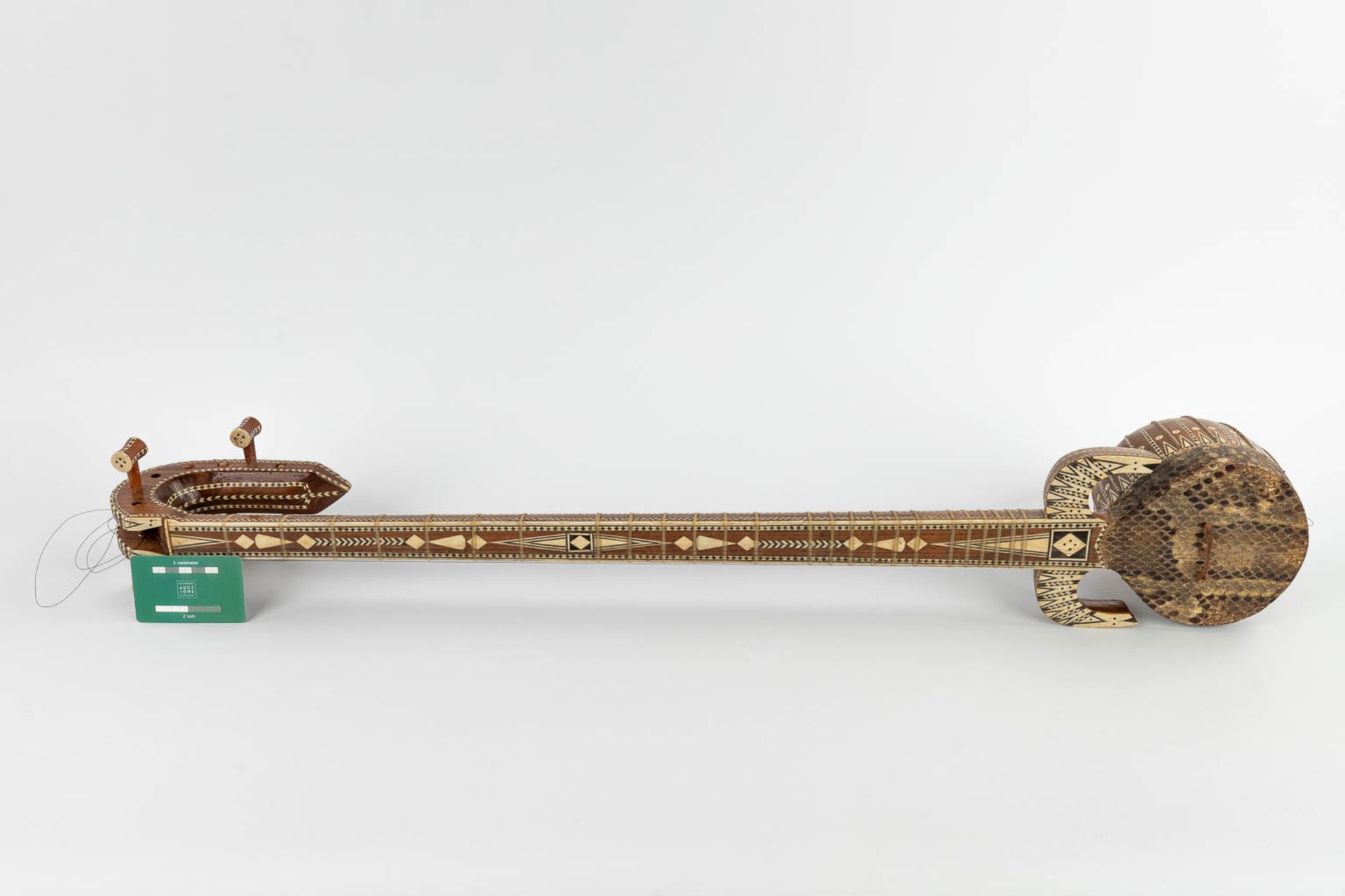 An oriental musical instrument with 6 strings, snake leather and bone inlay. 20th C. (D:13 x W:15 x - Image 2 of 17
