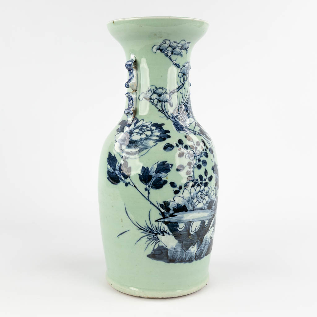 A Chinese celadon vase with blue-white decor of flora. 19th/20th C (H:42 x D:19 cm) - Image 3 of 12