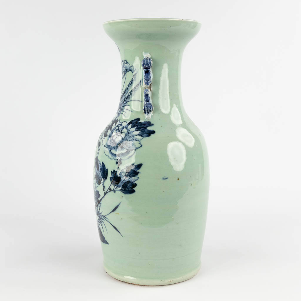 A Chinese celadon vase with blue-white decor of flora. 19th/20th C (H:42 x D:19 cm) - Image 6 of 12