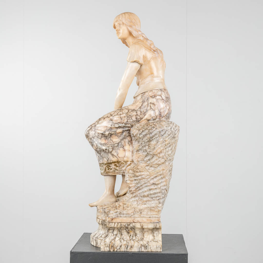 A statue of a lady, seated on a rock. Sculptured alabaster. 19th c. (D:27 x W:28 x H:88 cm) - Image 3 of 11