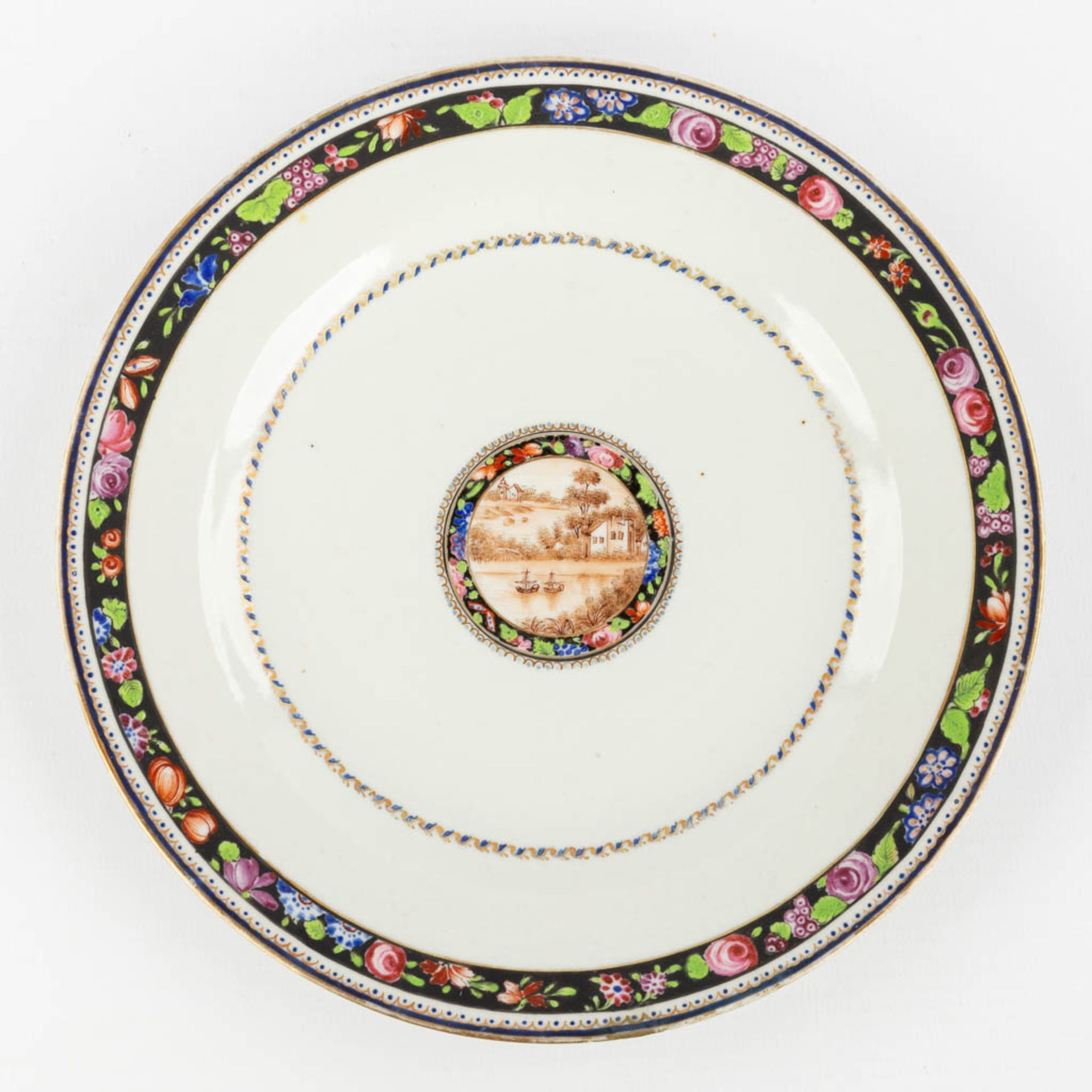 An antique Chinese Famille Rose plate with a river landscape for the Brazilian market, Qianlong peri