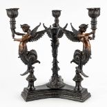 A large table candelabra decorated with three 'Mélusines', patinated bronze. 20th C. (D:35 x W:35 x