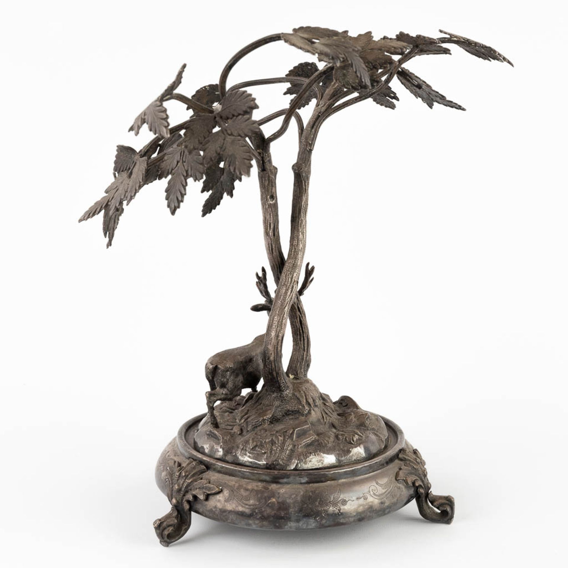 A figurine of a deer, walking under tall trees. Silver-plated bronze. Circa 1900. (D:24 x W:30 x H:3 - Image 6 of 13