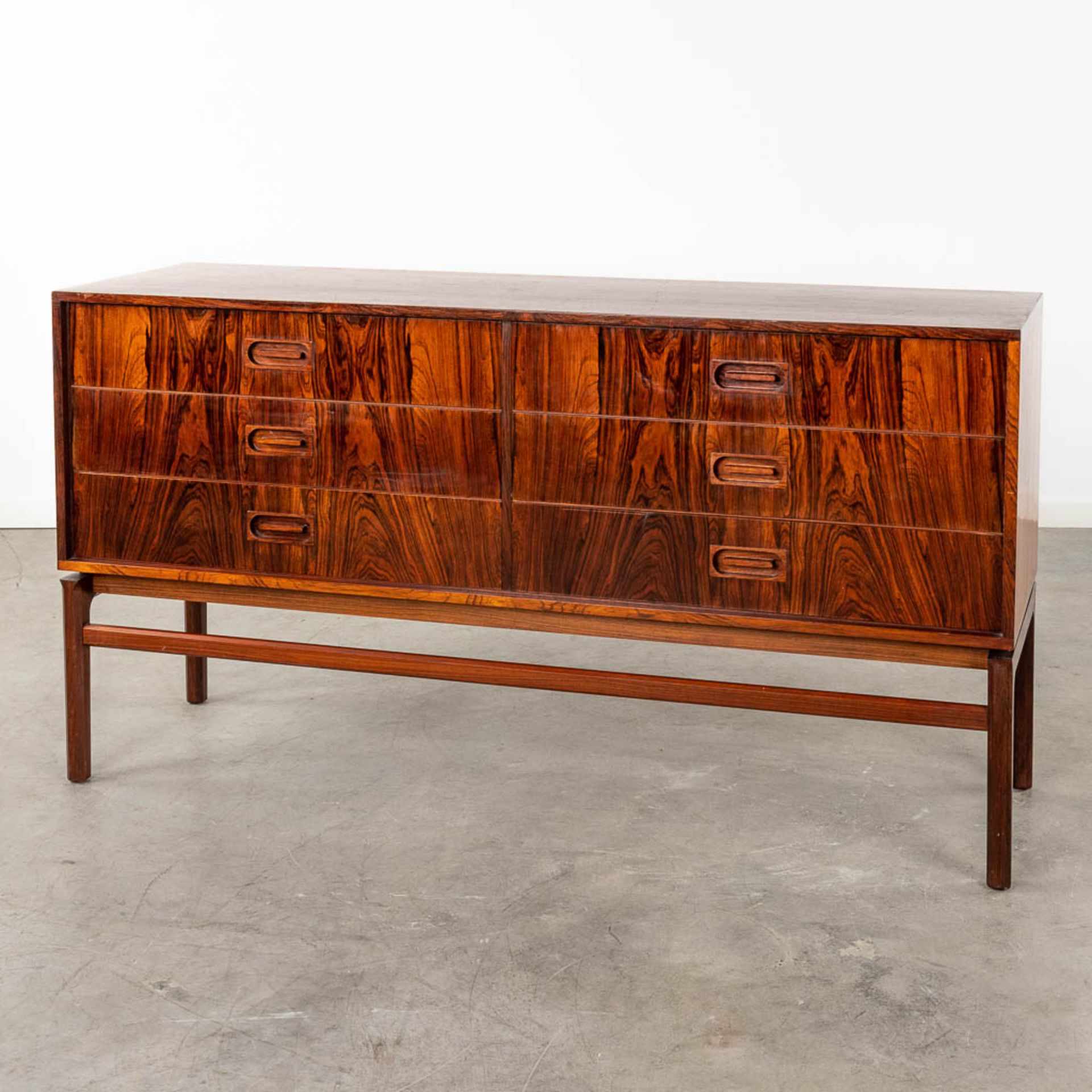A mid-century Scandinavian Sideboard with 6 drawers, and rosewood veneer. (D:45 x W:150 x H:80 cm)