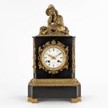 A mantle clock, black marble with a bronze figurine. 19th C. (D:12 x W:22 x H:41 cm)