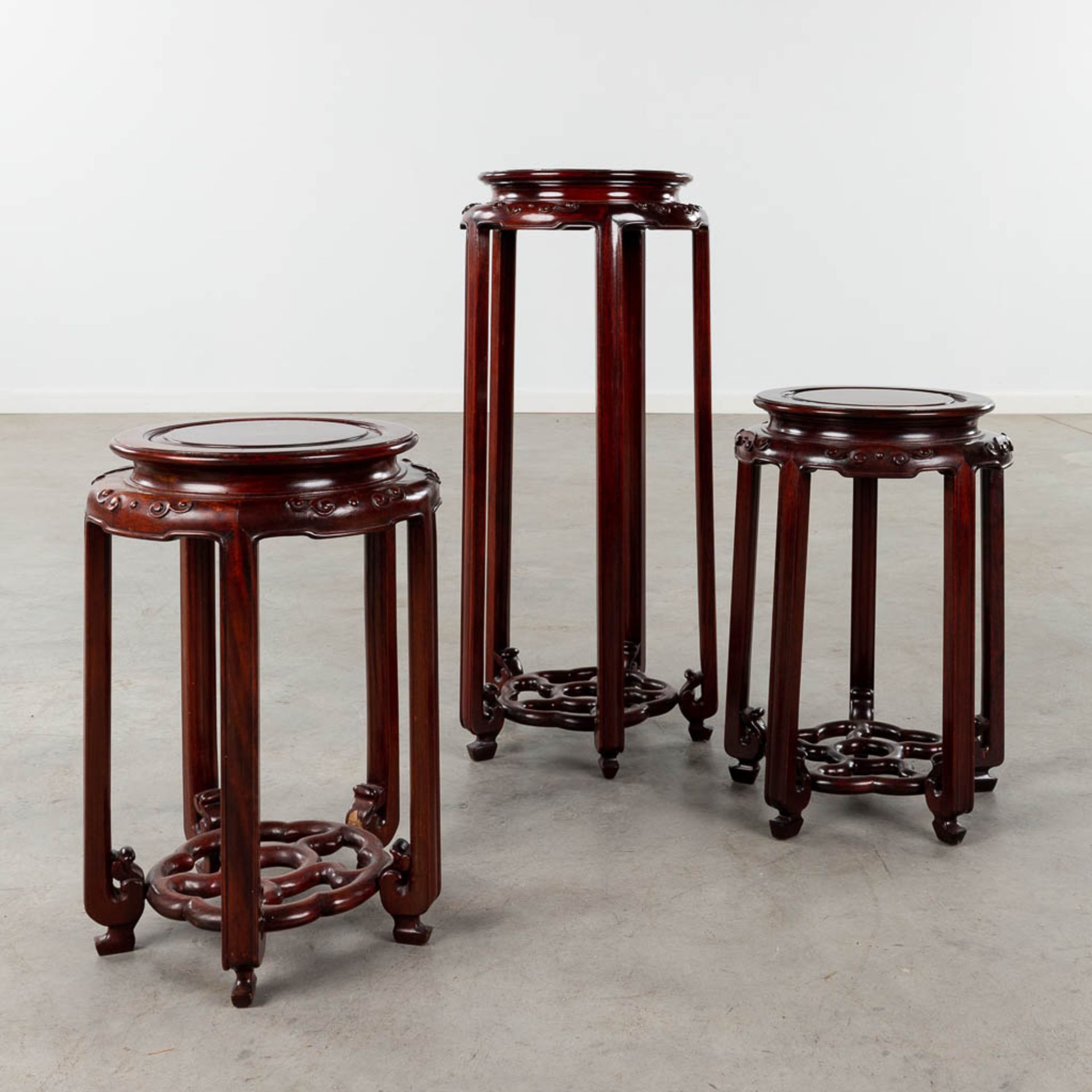 Three Oriental pedestals, sculptured hardwood. 20th C. (H:71 x D:30 cm)