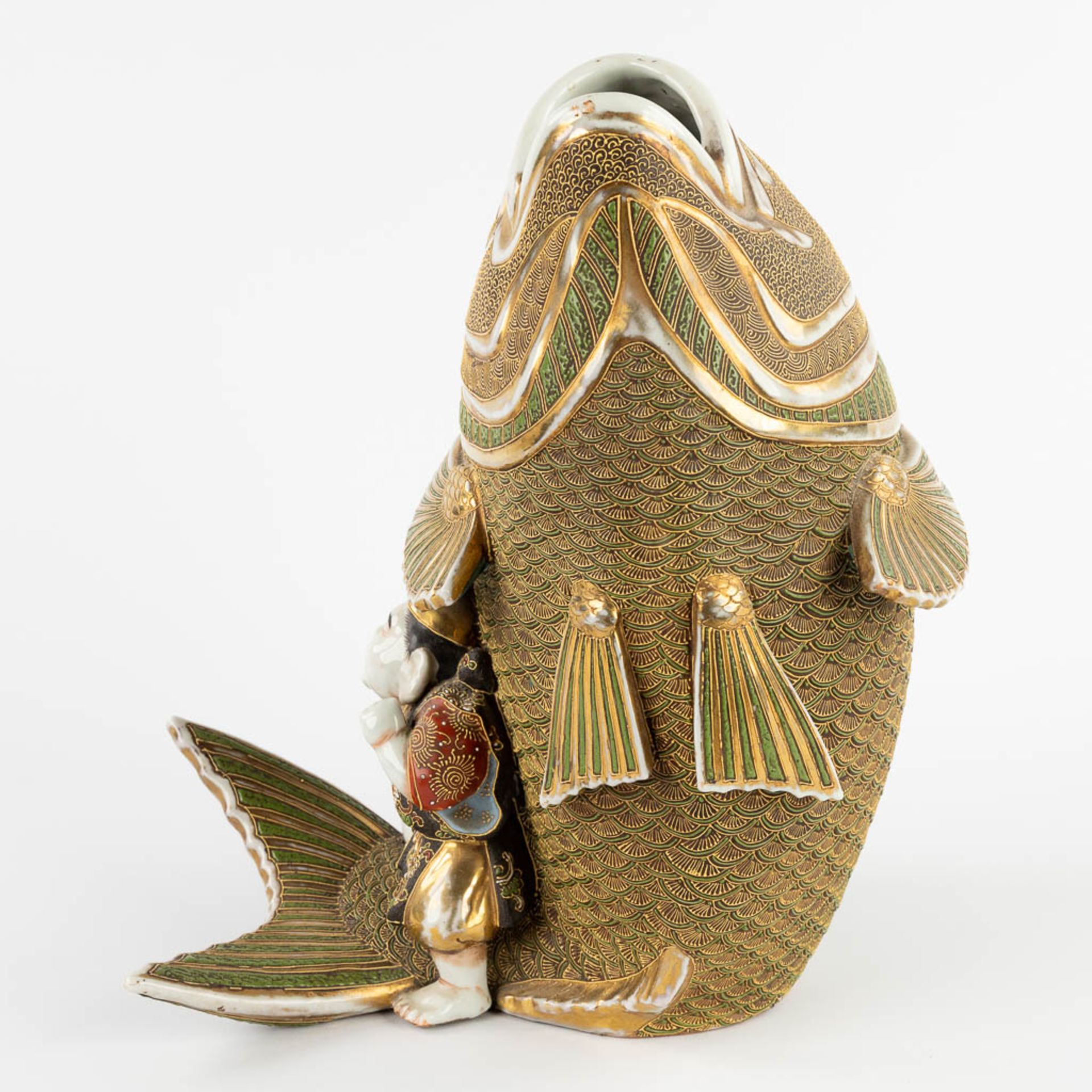 A figurine seaed on a koi, Satsuma stoneware. Meji period. (D:27 x W:26 x H:31 cm) - Image 5 of 11