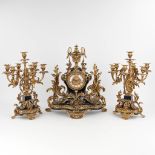 A three-piece mantle garniture clock and candelabra, Louis XV style. Circa 1970. (D:25 x W:51 x H:55