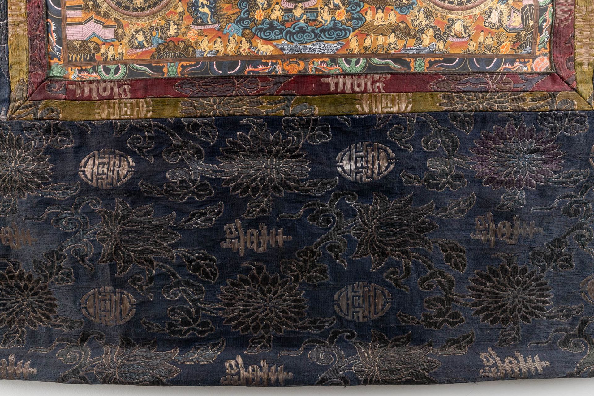 An Eastern Thangka, hand-painted decor on silk. (W:57 x H:74 cm) - Image 11 of 13