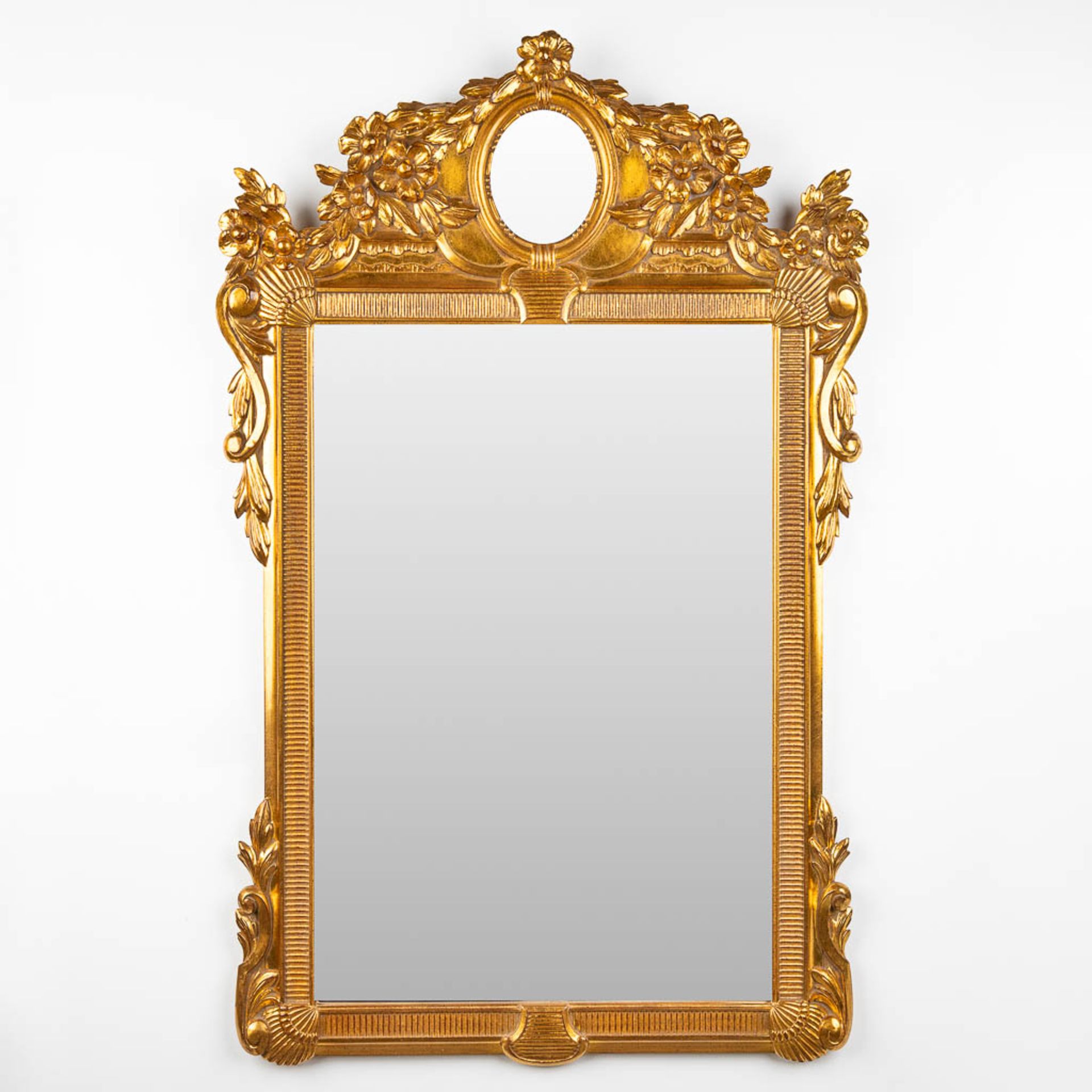 Deknudt, a gold-plated mirror. 20th C. (W:76 x H:124 cm)