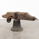 An antique bronze bell mounted on a wood base. 18th C. (W:120 x H:52 x D:36 cm)