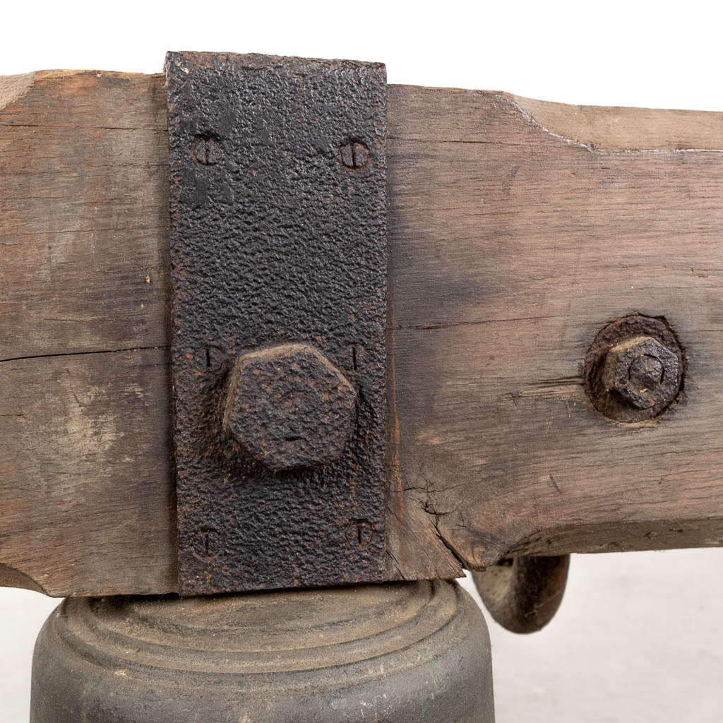 An antique bronze bell mounted on a wood base. 18th C. (W:120 x H:52 x D:36 cm) - Image 9 of 11